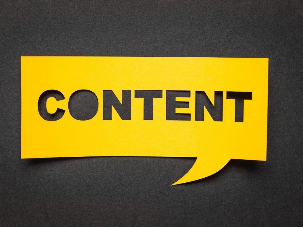 A bold yellow speech bubble with the word CONTENT cut out, set against a dark background